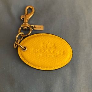 Coach bag tag charm